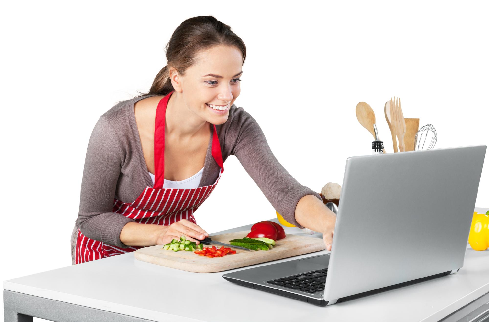 Student cooking at home with a laptop